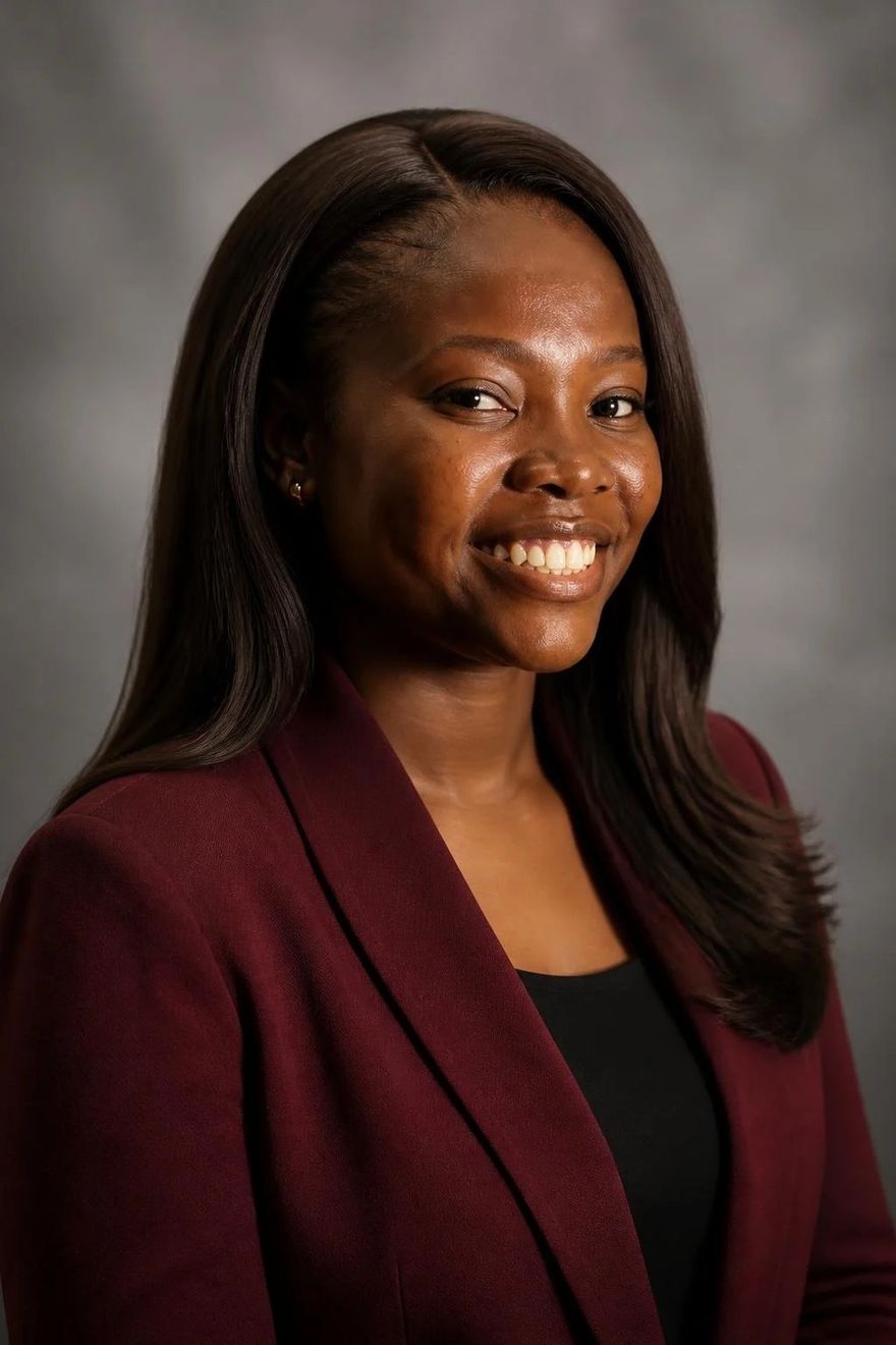 Faith Ogali wearing a burgundy blazer