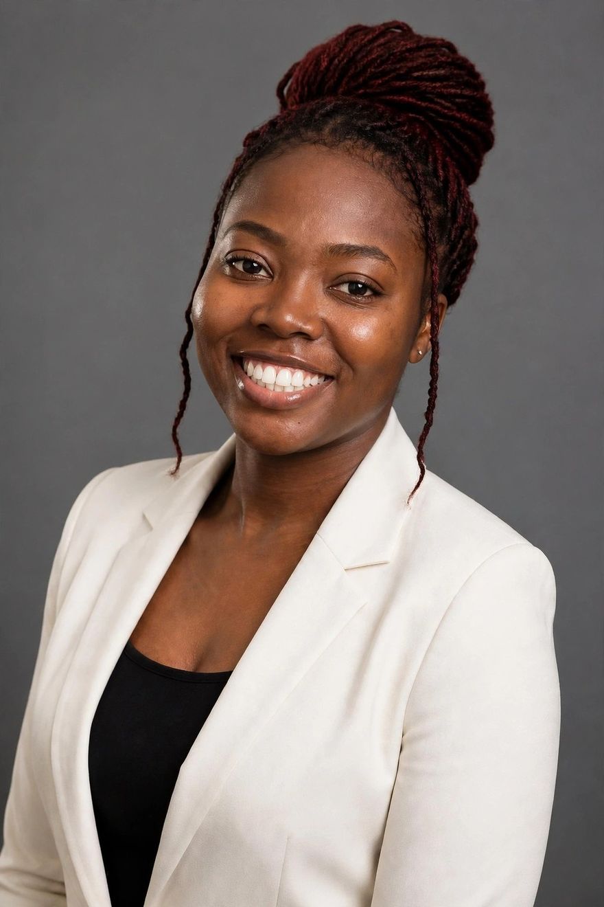 Faith Ogali wearing a white blazer